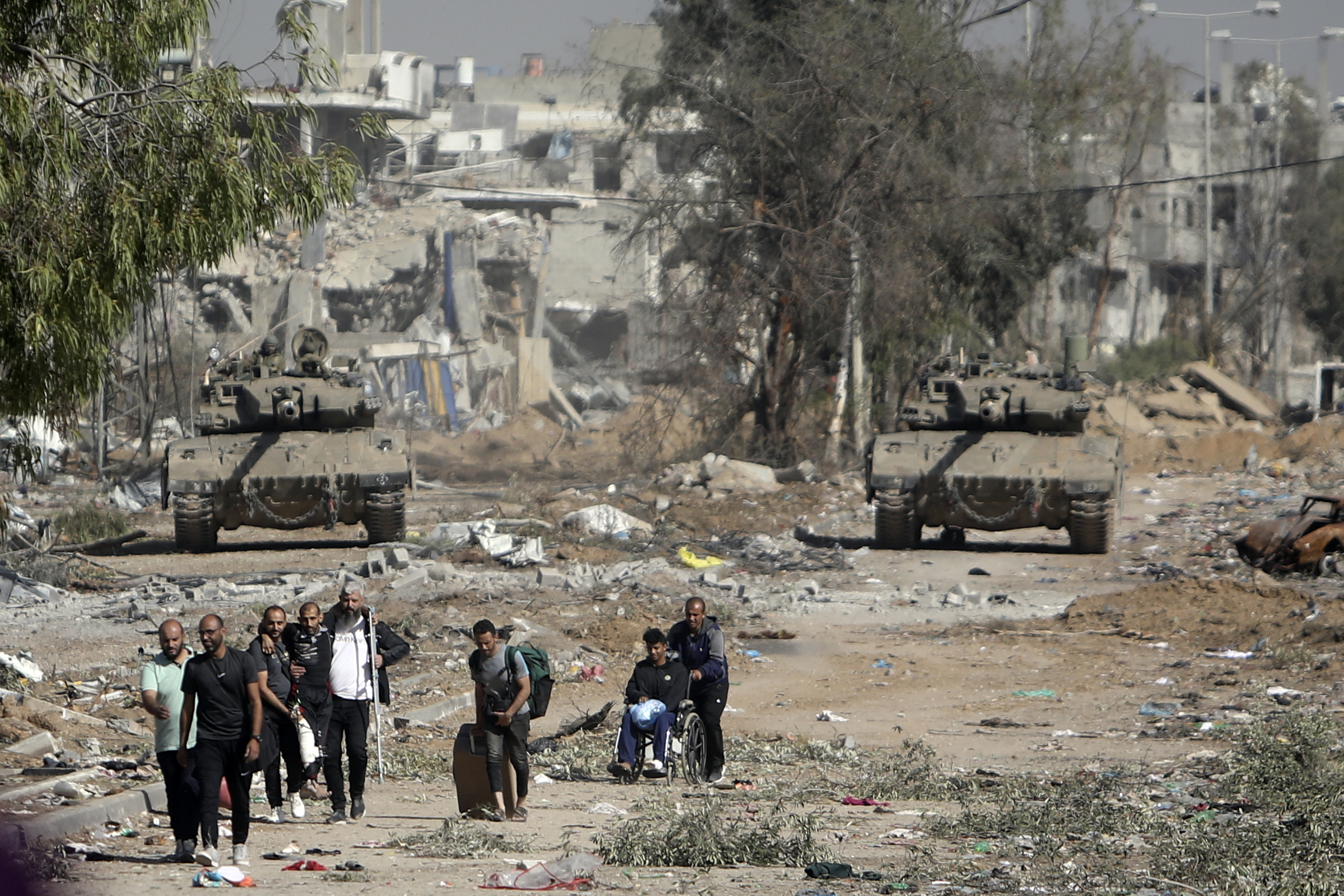 Palestinians flee to northern Gaza as Israeli tanks block the Salah al-Din road in the central Gaza...