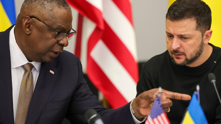 Image: U.S. Secretary of Defense Lloyd Austin, left, speaks with Ukraine's President Volodymyr Zele...