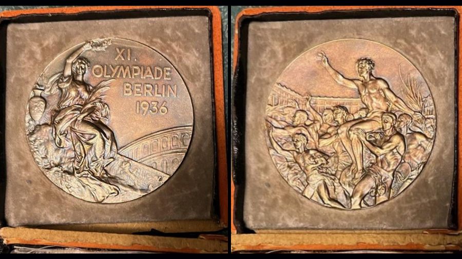 Photo: Front and back of Olympic "Boys in the Boat" rower John White's gold medal....