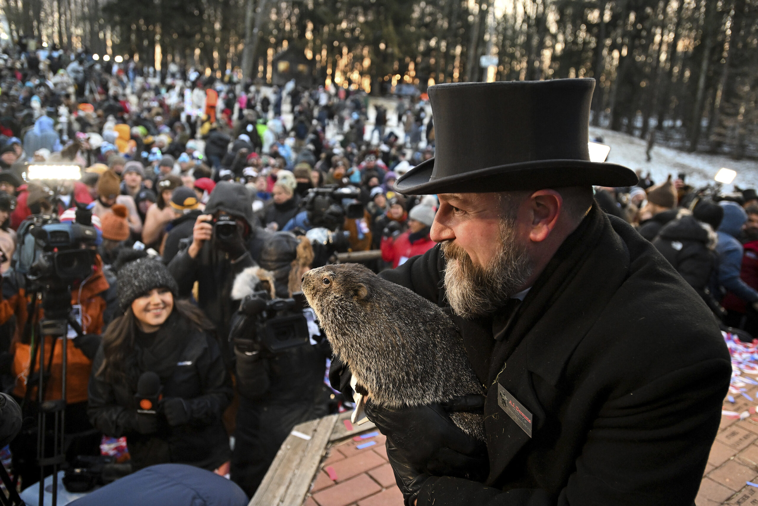 FILE - Groundhog Club handler A.J. Dereume holds Punxsutawney Phil, the weather prognosticating gro...