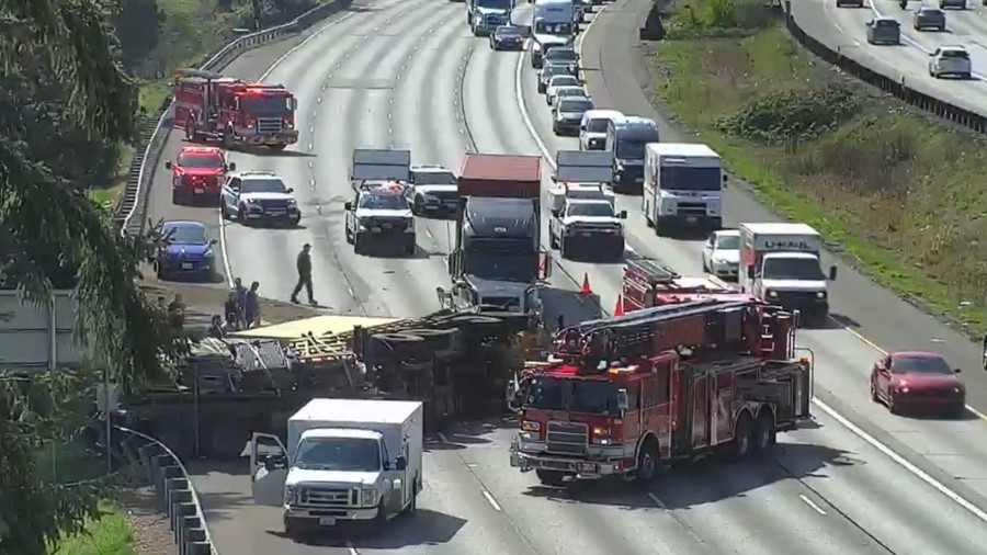 Image: All general-purpose lanes were blocked leaving just the left HOV lane open on I-5 south of 2...