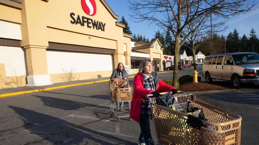 Image: Vicki Phillips, right, and her friend Wendy Priest take advantage of senior shopping hours a...