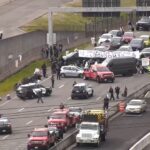 Image: A tow truck removes one of the cars blocking the expressway leading to Seattle-Tacoma International Airport on Monday, April 15, 2024. A pro-Palestinian protest closed the road to the airport. 