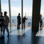 People wait at Edge at Hudson Yards before a partial solar eclipse on April 08, 2024 in New York City. While New York City isn't in the path of totality, it will see up to 90% of the sun covered by the moon. (Photo: Spencer Platt, Getty Images)