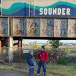 Image: Historian Jack O'Donnell explains the significance of the Everett Massacre and the bricks and railroad bridge on Hewitt Avenue to KIRO Newsradio's Feliks Banel.