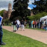 A person holds an Israel flag at a pro-Palestinian tent encampment on the campus of the University of Washington in Seattle on Monday, April 29, 2024. (Photo: Feliks Banel, KIRO Newsradio)