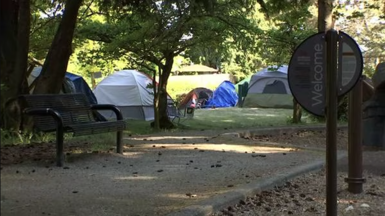 Photo: The homeless encampment outside city hall is being moved around Burien to another home at Do...